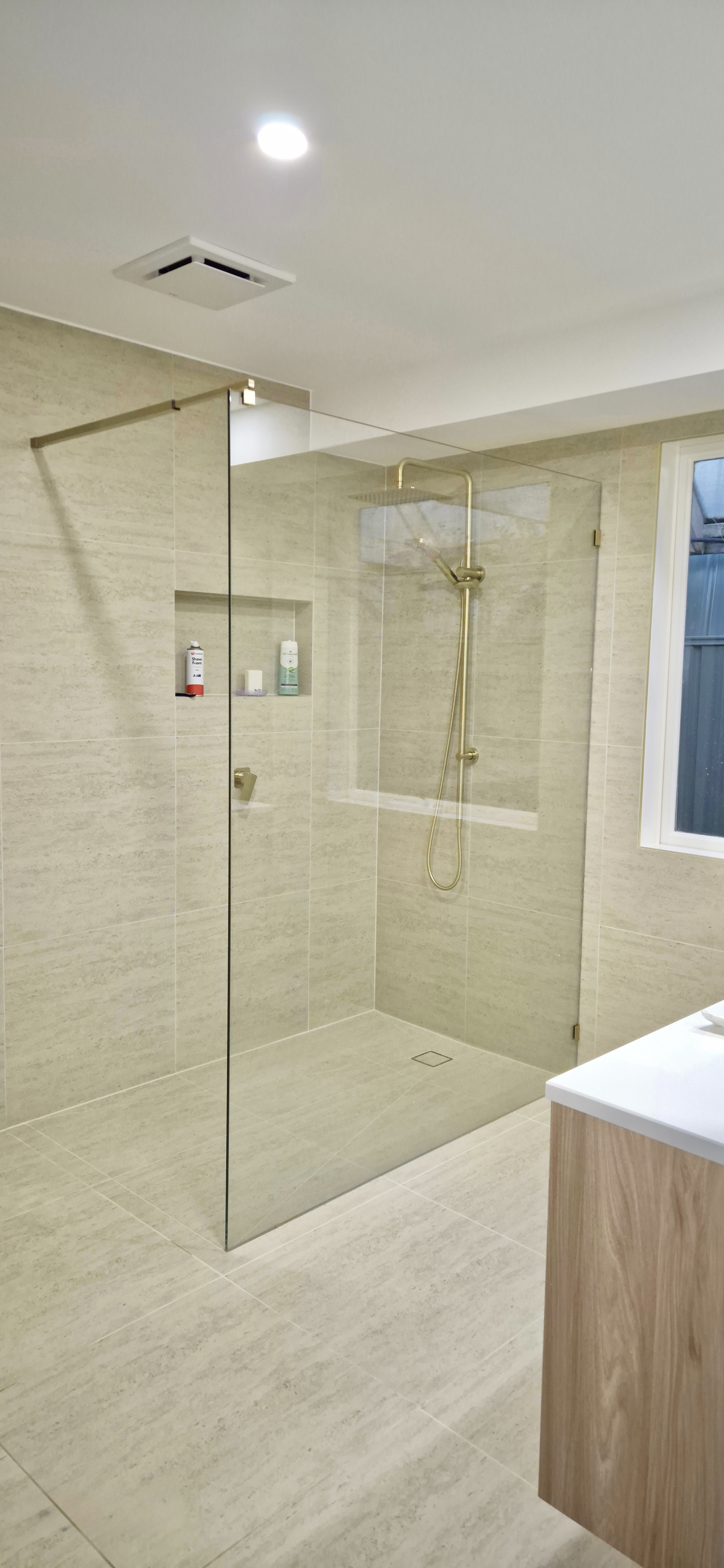 Frameless Shower Panel with our Brushed Gold Hardware