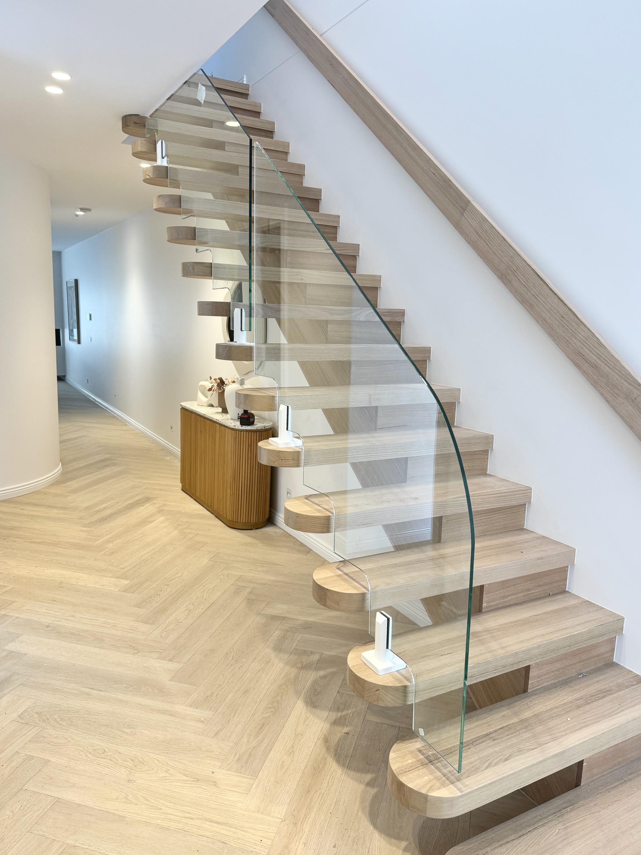 Custom Glass Staircase with our Matte White Spigots